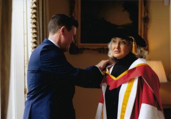 Anton Savage with his mother Terry Prone in April 2023 when she received an ho<em></em>norary doctorate from the University of Limerick. Terry recalls how, as a child, Anton helped her with exercises to straighten her arm, rewarding himself with wheelies in her wheelchair. <em></em>	Picture: True Media<em></em>
                    